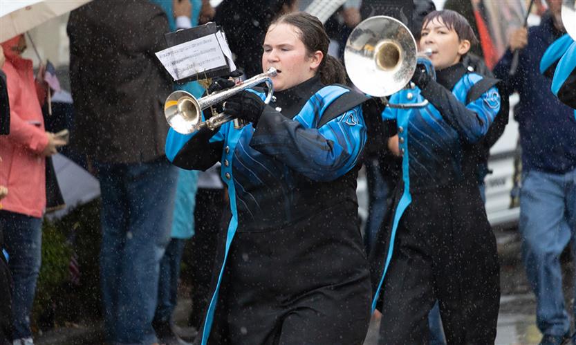 Students march in a Veterans Day Parade